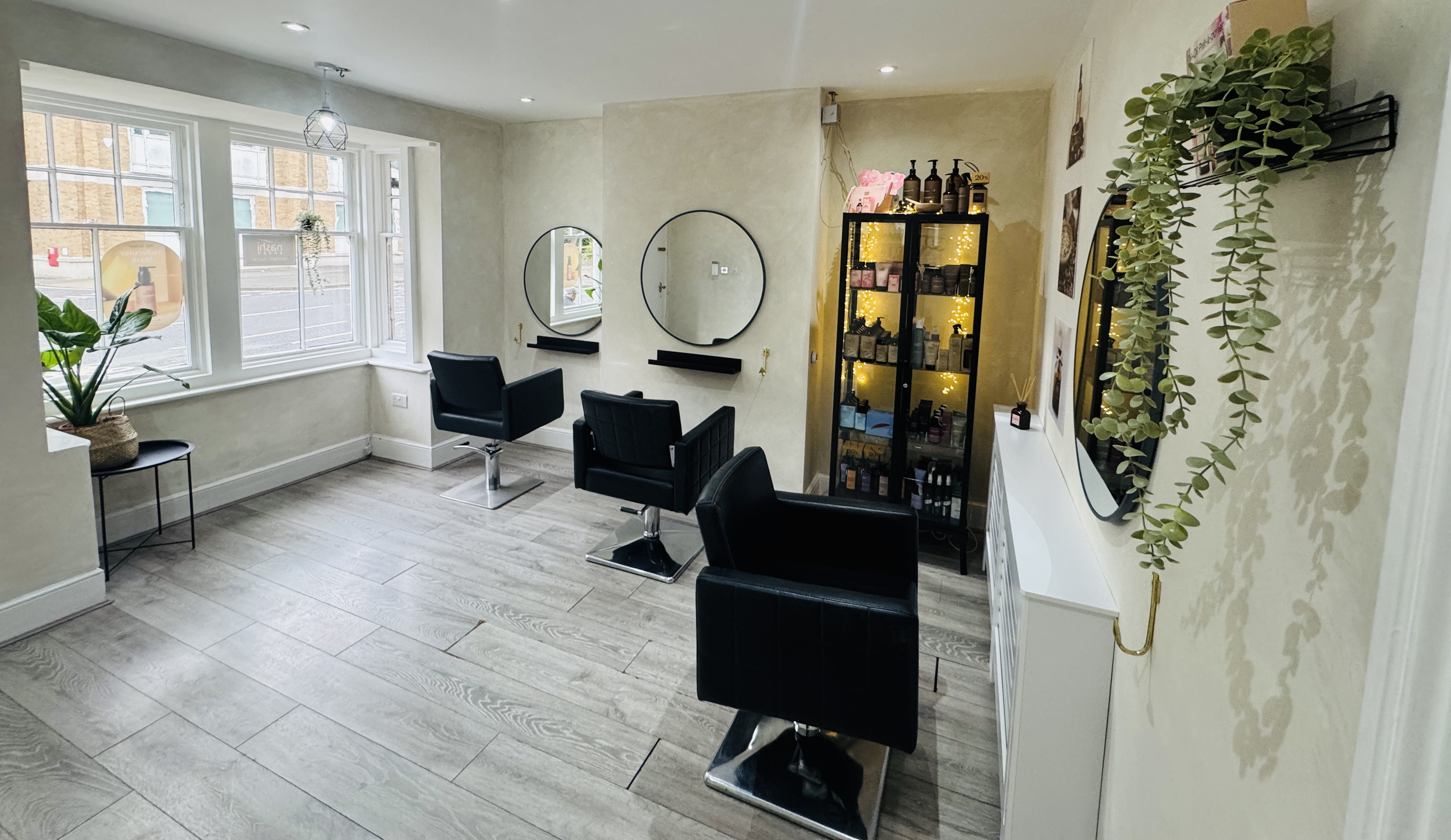Interior of our salon with styling chairs and mirrors